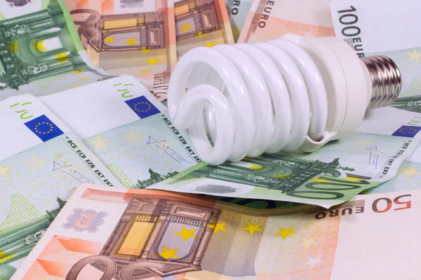 Saving Money Saving Bulb.lightbulb On Money Euro Background — Stock Photo, Image