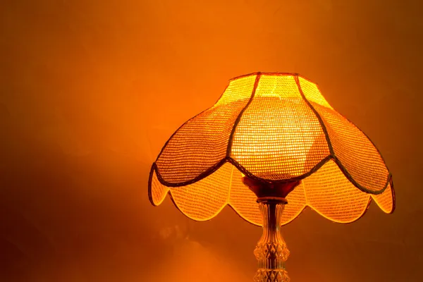 Lighting home lamp besides stucco wall — Stock Photo, Image