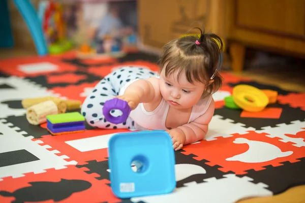 Infant Girl Sitting Belly Playing Different Objects — Stock Photo, Image