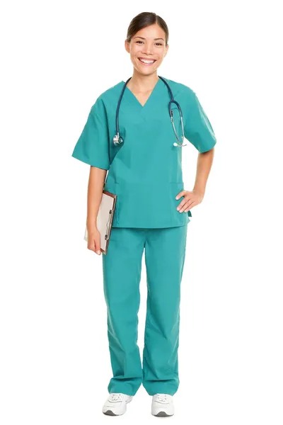 Pielęgniarka, stojący uśmiechający się na białym tle — Zdjęcie stockowe