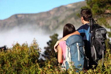 Couple hiking looking at view clipart