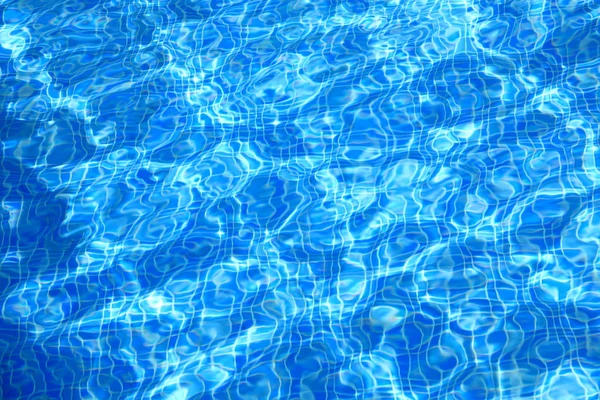 Água da piscina - textura de fundo azul — Fotografia de Stock