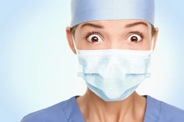 Doctor surgeon woman shocked — Stock Photo, Image