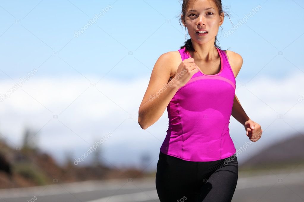 Woman runner training for marathon Stock Photo by ©Maridav 22312355