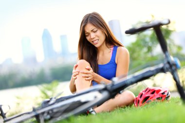 Knee pain bike injury woman clipart
