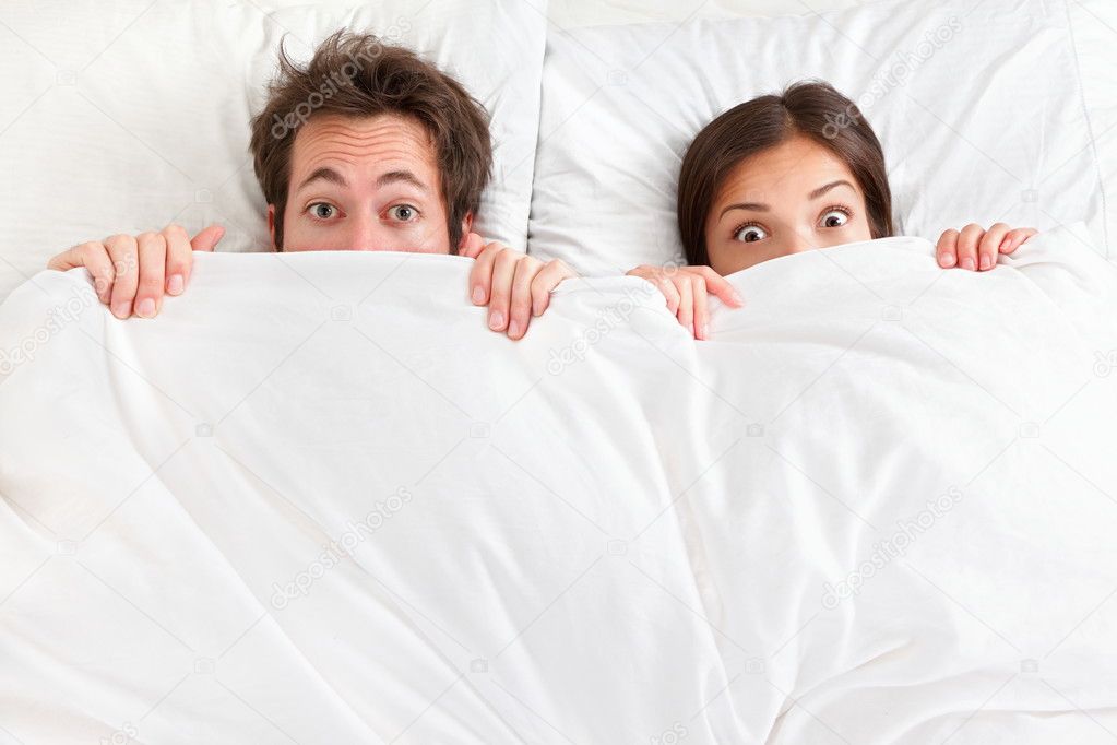 Images: funny couple bed sheets | Funny couple in bed — Stock Photo