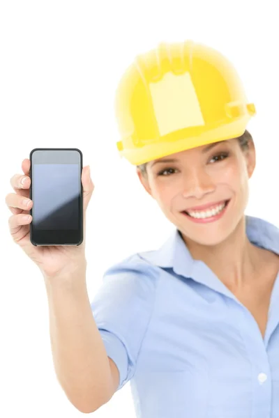 Engineer or architect woman showing smart phone — Stock Photo, Image