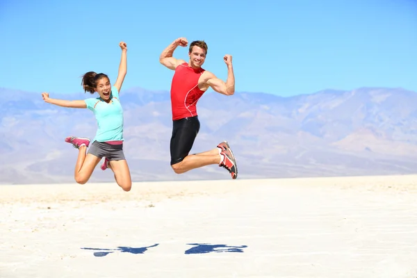 Success - young runners jumping — Stock Photo, Image