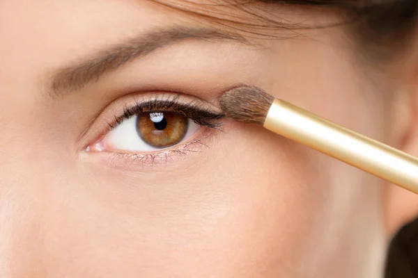 Eye makeup woman applying eyeshadow powder Royalty Free Stock Images