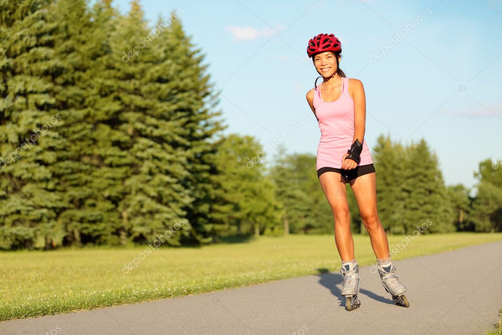 Roller skating girl in park Stock Photo by ©Maridav 24537549