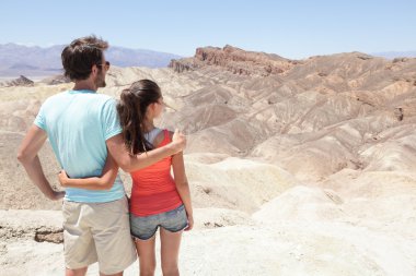 Death Valley tourists in California enjoying view clipart