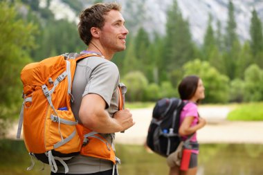 Hikers - hiking, man looking in Yosemite clipart