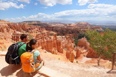 Hikers in Bryce Canyon resting enjoying view clipart