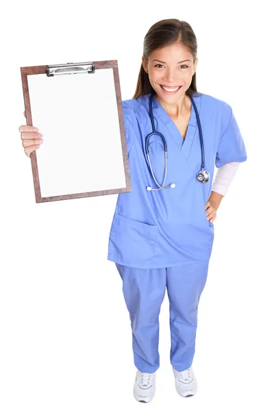 Medical nurse woman or doctor showing clipboard — Stock Photo, Image