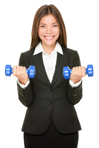 Business woman in suit lifting dumbbell weights — Stock Photo, Image
