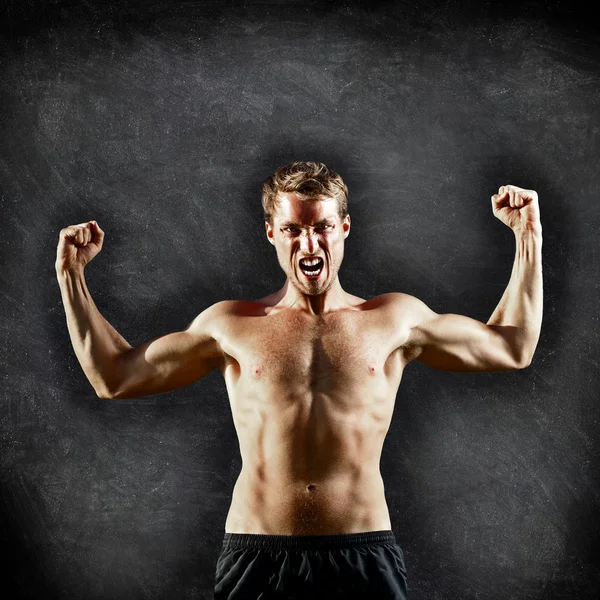 Crossfit fitness man flexing strong on blackboard — Stock Photo, Image