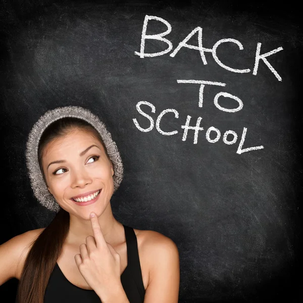 Back to school chalkboard - woman student thinking — Stock Photo, Image