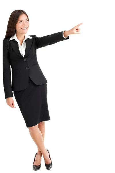Young Businesswoman Pointing At Copyspace Stock Photo