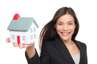 Real estate agent selling home holding mini house clipart