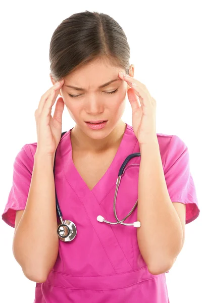 Verpleegster met hoofdpijn en stress — Stockfoto