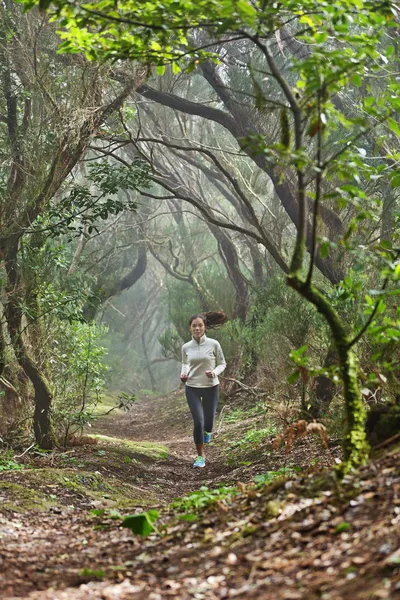 Runner woman cross-country running in forest — Stock Photo, Image