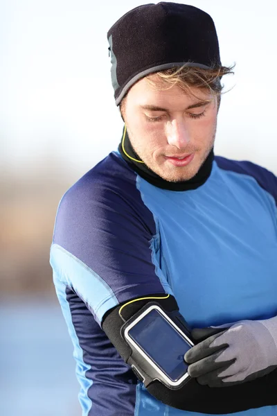 Lauftrainingsmusik auf Smartphone-App - Läufer — Stockfoto