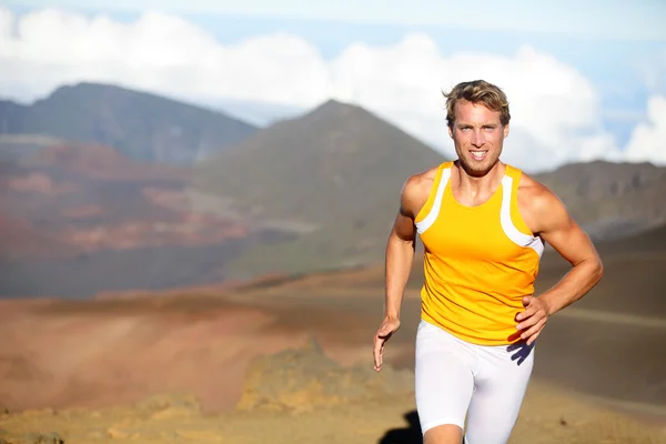 Running athlete - man runner sprinting fast — Stock Photo, Image