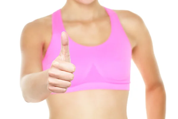 Thumbs up fitness woman in sports bra close up — Stock Photo, Image