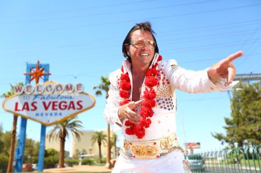 Elvis look-alike impersonator and Las Vegas sign clipart