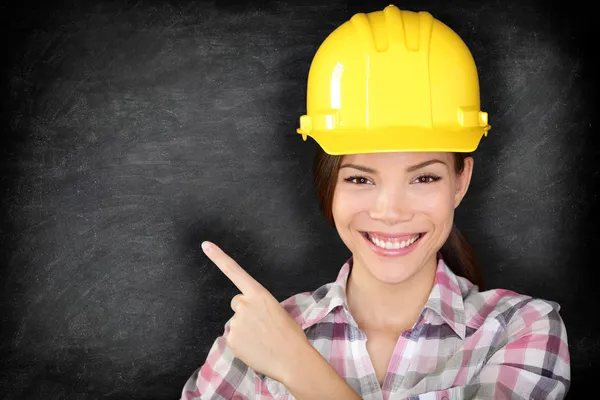 Female construction worker or engineer showing — Stock Photo, Image