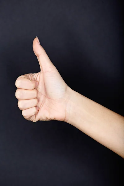 Thumbs up close up on black background — Stock Photo, Image