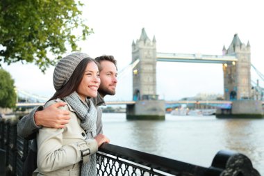 Happy couple by Tower Bridge, River Thames, London clipart