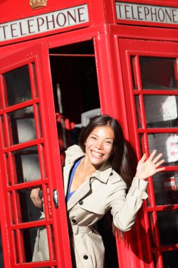 London red phone booth - woman waving happy clipart