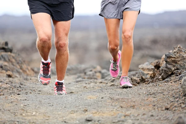 Trail running - close up of runners shoes and legs — Stock Photo, Image