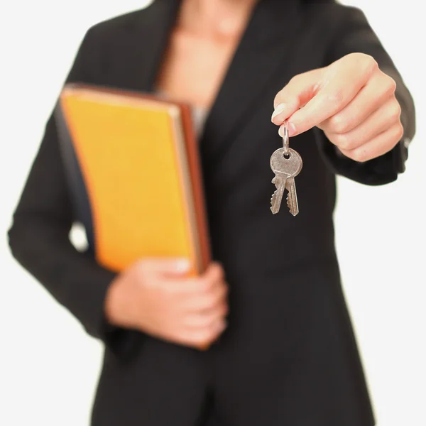 Real estate agent holding keys — Stock Photo, Image