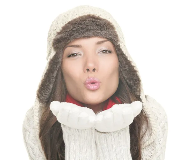 Beautiful winter woman blowing kiss isolated — Stock Photo, Image