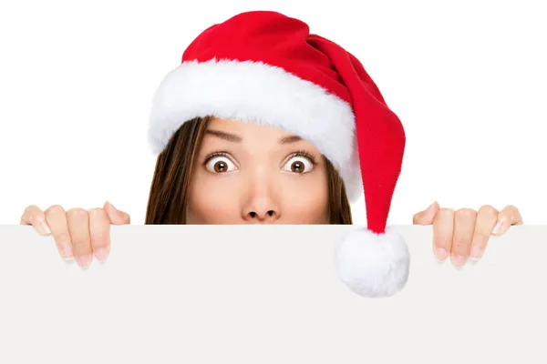 Frau mit Weihnachtsmütze zeigt Weihnachtszeichen — Stockfoto