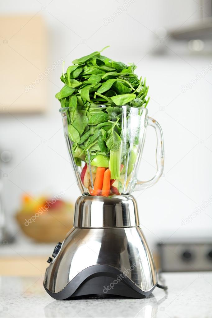 Green vegetable smoothie in blender Stock Photo by ©Maridav 40836605