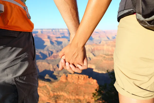 Romantic hiking couple holding hands — Stock Photo, Image