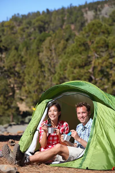 Camping people - couple eating in tent happy — Stock Photo, Image