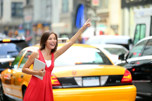 Girl calling taxi cab in New York City Royalty Free Stock Photos