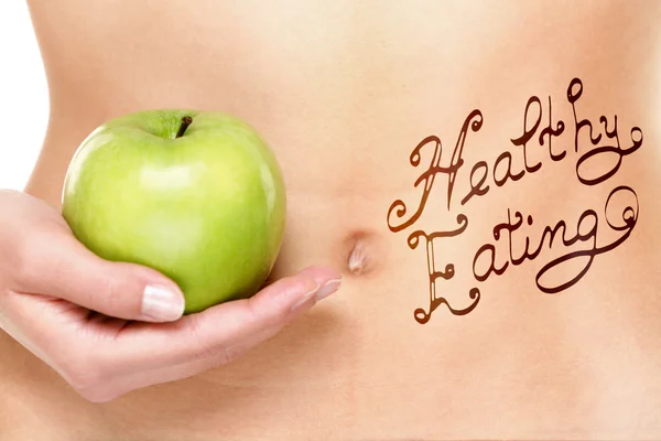 Healthy eating concept - woman stomach and apple — Stock Photo, Image