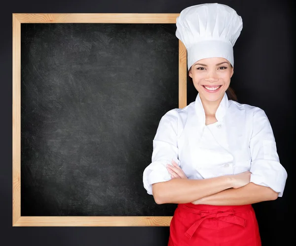 Chef mostrando quadro-negro menu — Fotografia de Stock