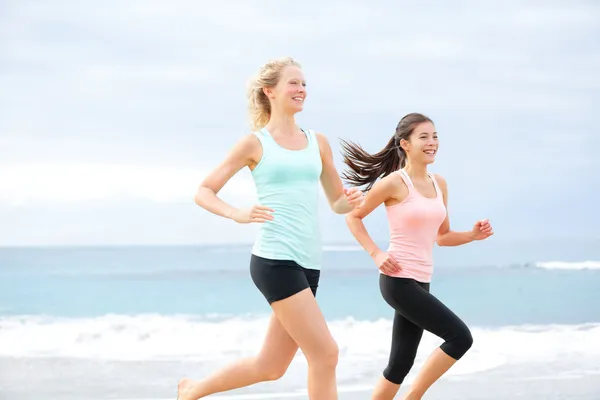 Runners - two women running outdoors — Stock Photo, Image