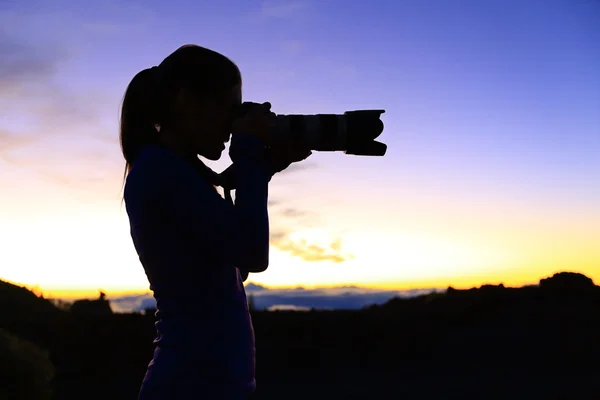 Photographer taking pictures with SLR camera — Stock Photo, Image