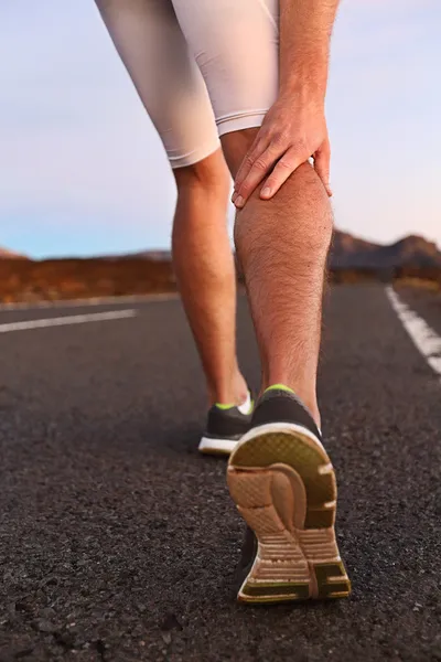 Cramps in leg calves or sprain calf on runner — Stock Image Cramps in leg calves or sprain calf on runner Royalty Free Stock Photos