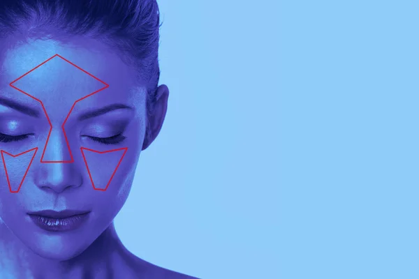 Facial recognition technology beauty woman face scan in blue light