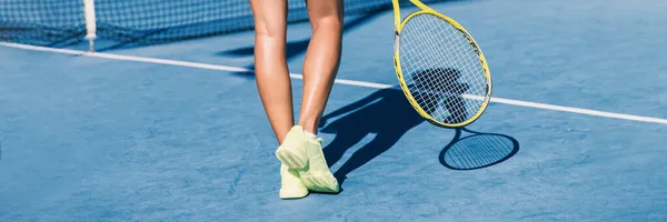 Tennis player woman shoes and racket on blue hard court background panoramic banner of athlete ready to play game. Sport exercise lifestyle. — Stock Photo, Image