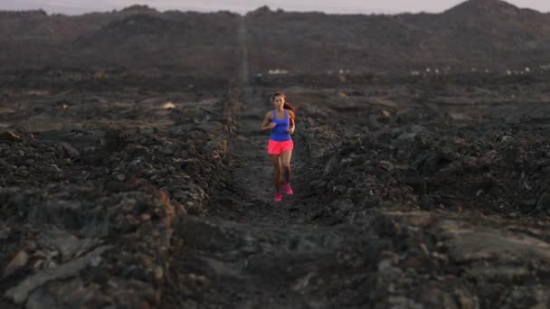 Woman runner running cross country trail run - female jogger exercising — Stock Video