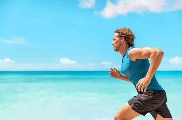 Athlete man runner training cardio running fast sprinting during beach workout running profile portrait. Active sport lifestyle. — Photo